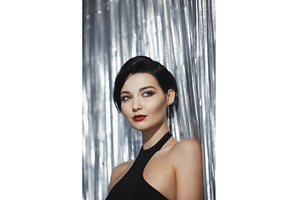 Fashion Woman in Black Dress on
