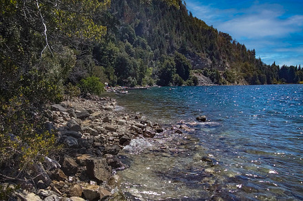 Empty landscape beach surrounded by forest, bariloche, rio negro, a Nature Photo by DanFLCreativo