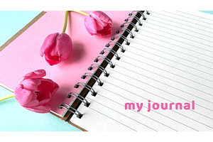 Open spiral notebook with pink, a Photo by tilialucida