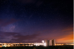 City lights against dramatic night, an Architecture Photo by Our Amazing World