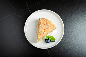 Medovik. Honey cake made from honey cakes with whipped sour cream, decorated wi