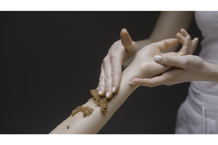 Close-up of masseur rubbing scrub on, a Person Photo by Media Whale Stock