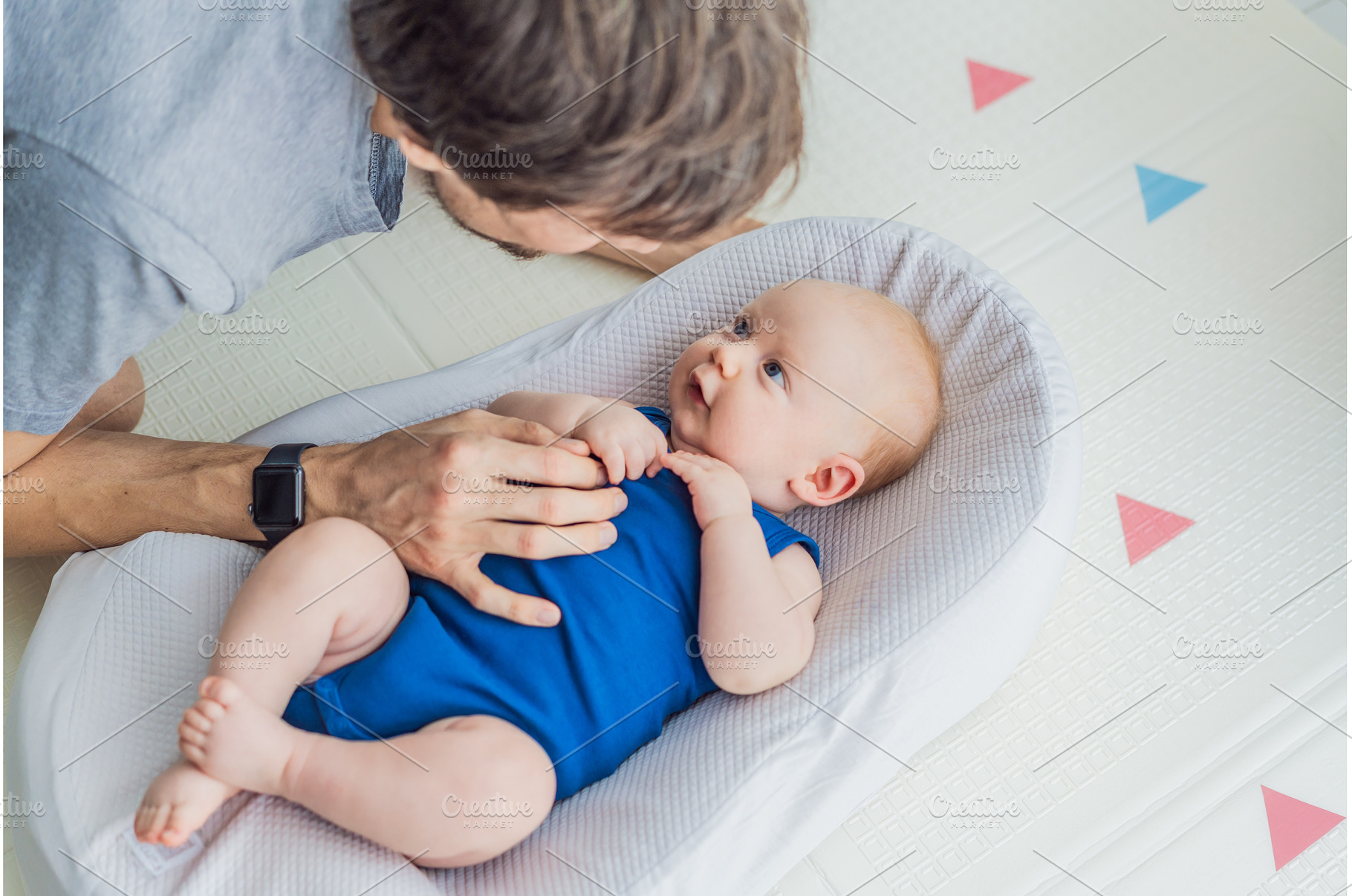 Loving father interacts with his 3, a Person Photo by Elizaveta Galitskaya
