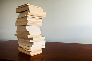 Book Stack on Table, a School & Education Photo by THP Creative