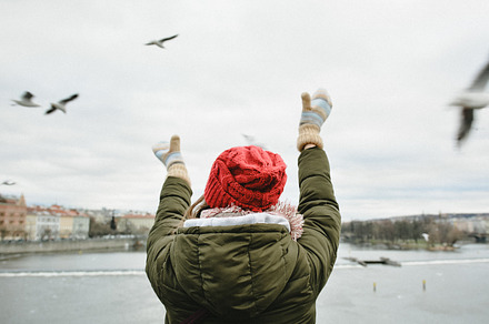 A girl Feeding Seagulls