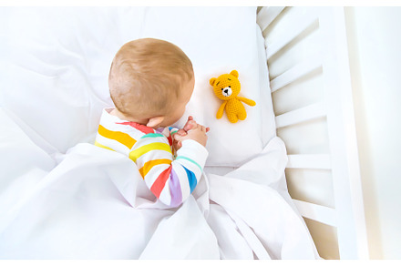 The baby in the crib goes to bed, a Person Photo by yanadjana