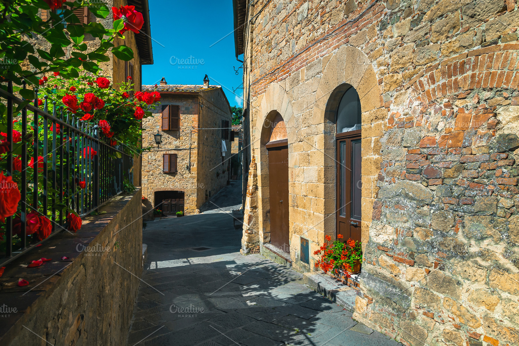 Stone houses and garden with roses, an Architecture Photo by Alpine Dreams