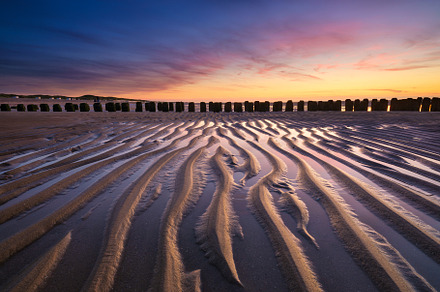Lines of sand on the seashore., a Nature Photo by Landscape and travel