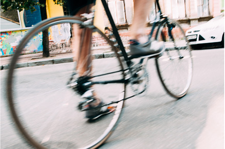 Blurry photo of male legs on bicycle, a Sports & Recreation Photo by Photo Drive Studio