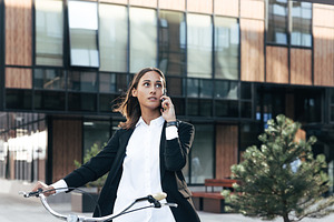 Young female with a bicycle, a Business Photo by Artem Varnitsin