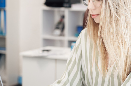 Young woman working on a computer, a Business Photo by Olena Rudo