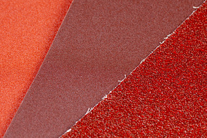several different sheets of sandpaper for metal or wood processing, a Photo by rsoollAI