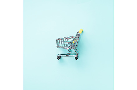 Shopping cart on blue background
