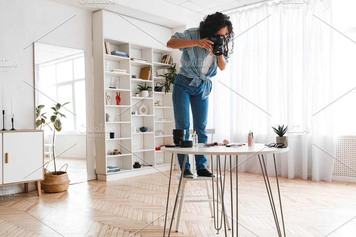 Photographer Woman Taking Photo Of Cosmetics Products On Desktop Indoor, a Photo by Prostock-Studio (Photo 2 of 4)