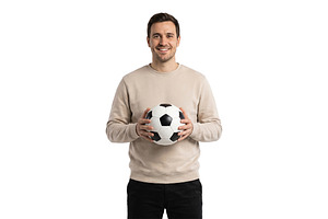 smiling young man with a soccer ball, a Person Photo by itakdalee