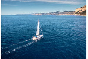 Aerial view of floating sailboat and