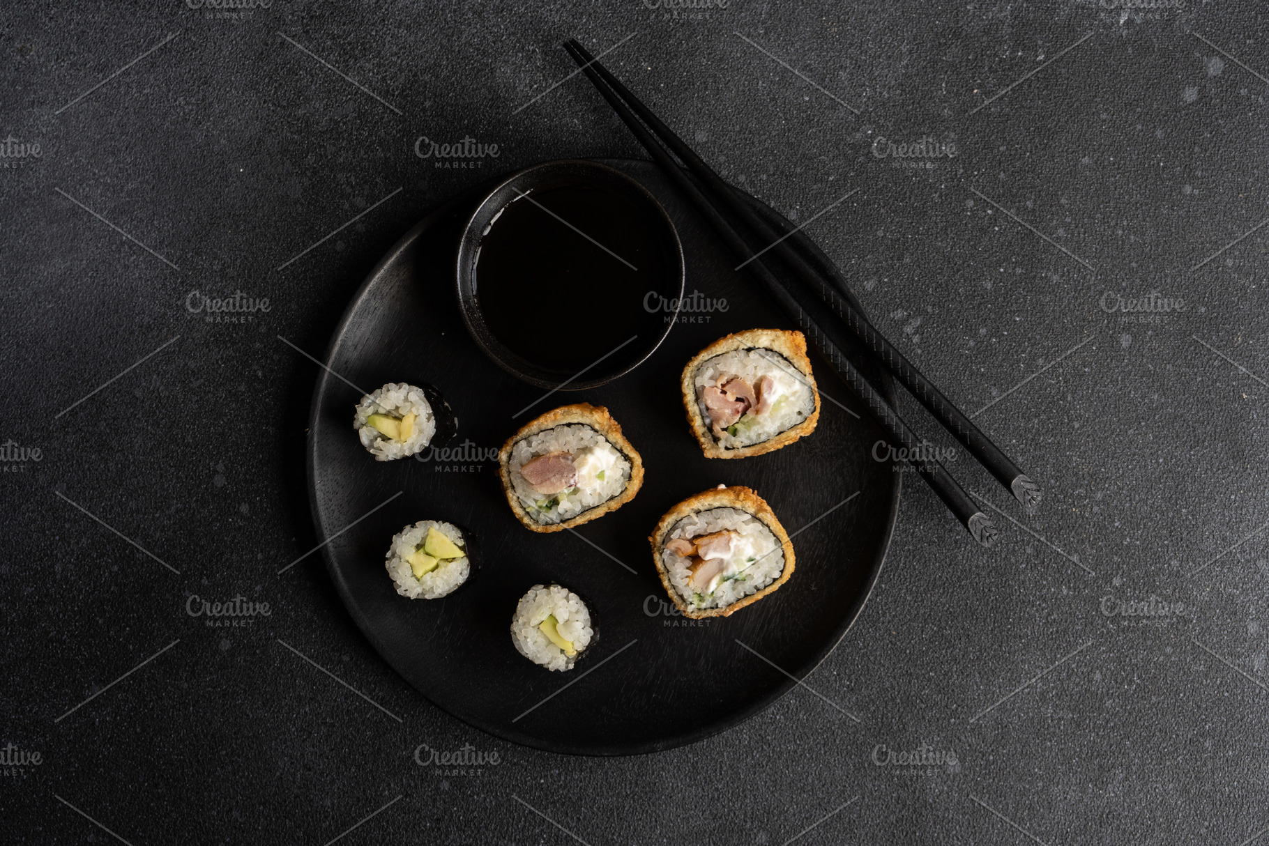 Fried sushi and avocako maki on the plate, a Food & Drink Photo by Anna Bogush