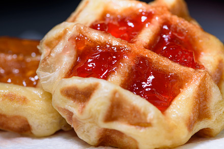 Close up fresh waffles with above strawberry jam