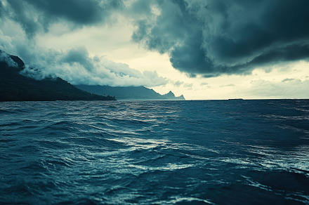Dark clouds loom over the ocean crea, a Photo by Tanuart