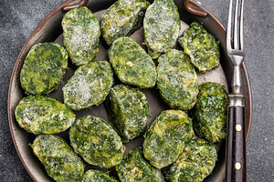 Raw, frozen green vegetable (spinach) portions in a metal servin, a Food & Drink Photo by composter-box@mail.ru