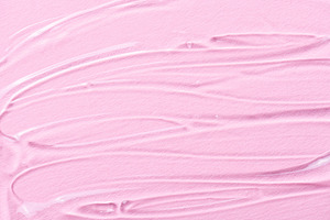 Liquid gel cosmetic texture on pink