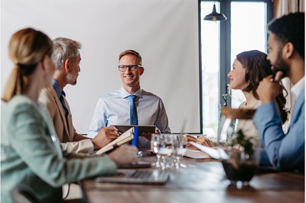 Young colleagues having meeting in, a Business Photo by HalfPoint