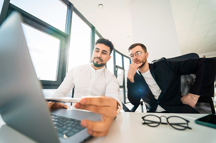 Two programmers are working, a Photo by borodai94