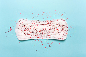 Women's hygiene products on a blue b stock photo containing menstrual and