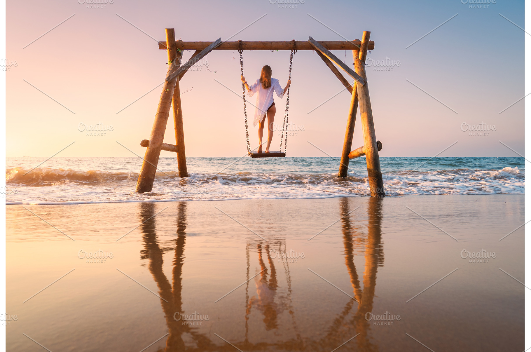 Happy young woman on wooden swing in, a Person Photo by den-belitsky