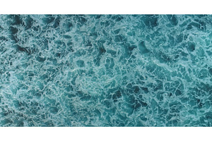 Turquoise ocean water surface with, a Nature Photo by Goinyk
