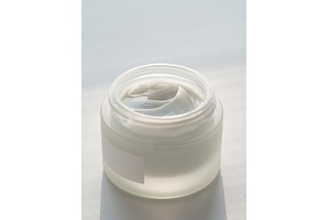 Open glasss jar with cosmetic cream, a Beauty & Fashion Photo by Fascinadora