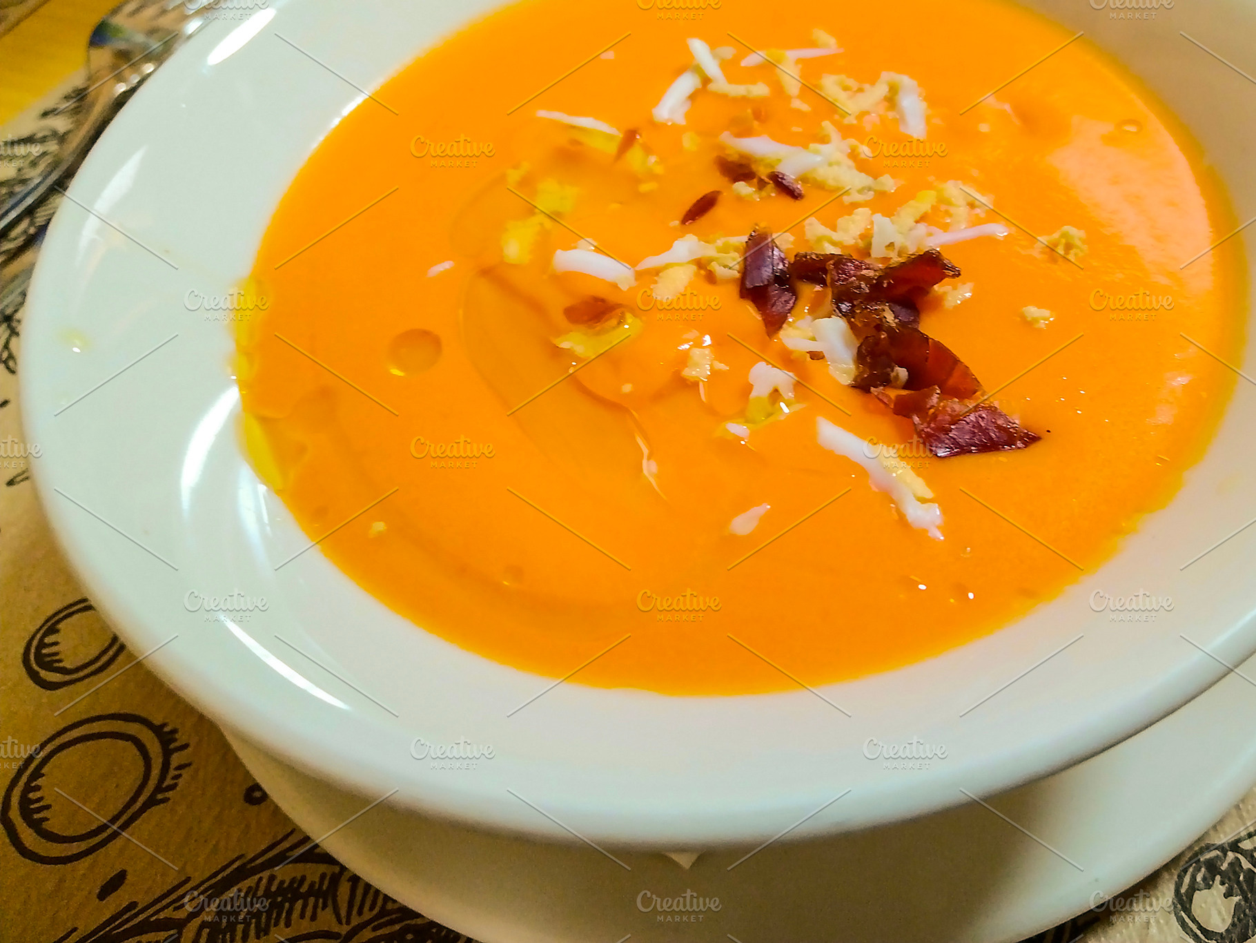 Salmorejo soup with ham and egg on rustic table, a Food & Drink Photo by DanFLCreativo