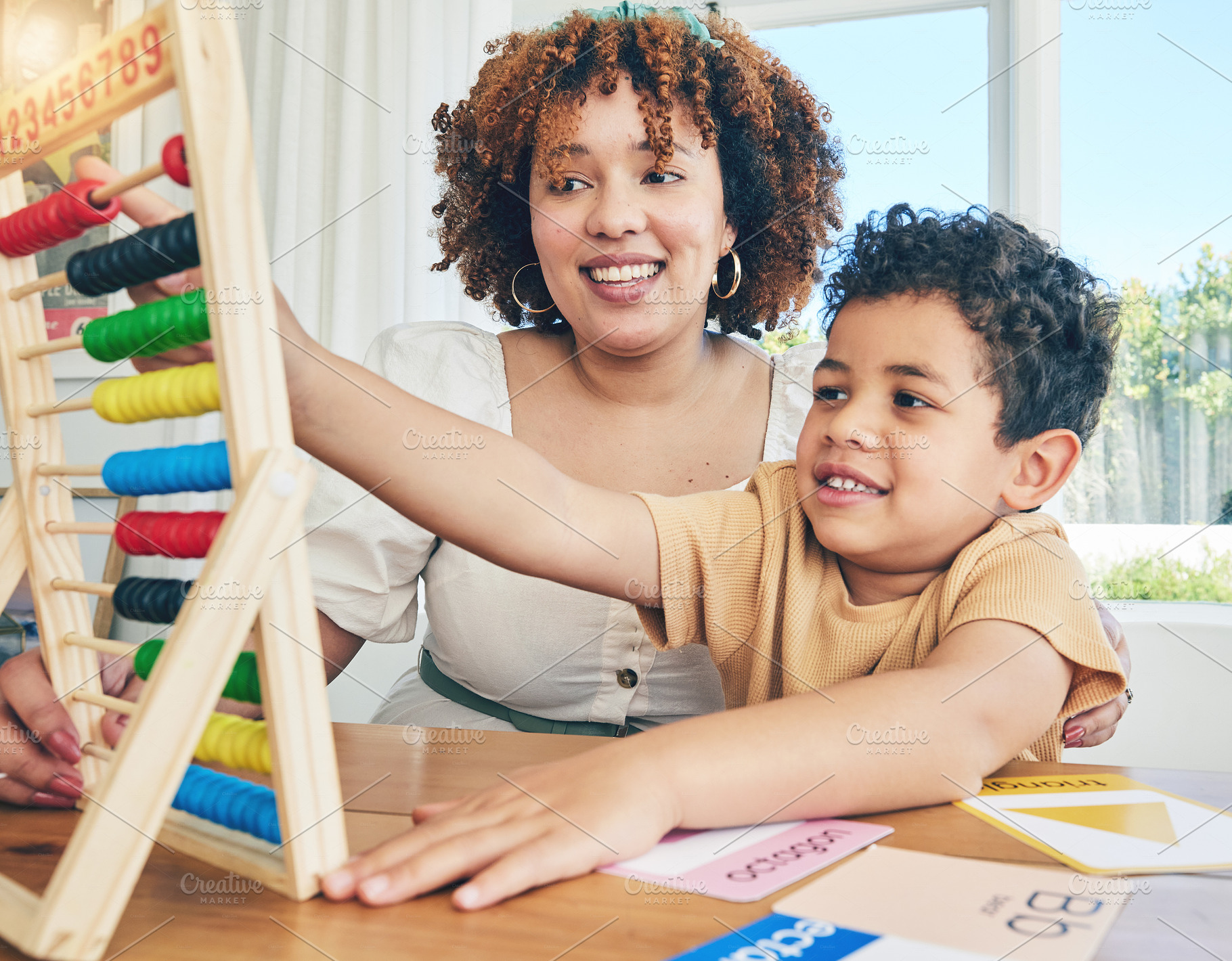 Learning, abacus and education with mother with son study for home schooling, kindergarten and tutor. Teaching, child development and lesson with black woman and child for colorful, math or creative, a Photo by Peopleimages.com