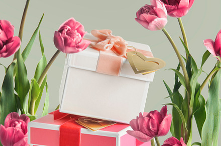 Gift boxes with pink tulip flowers