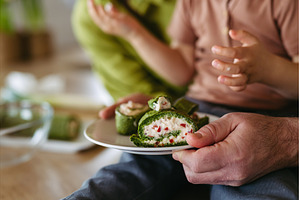 Close up of little boy eating green, a Food & Drink Photo by HalfPoint