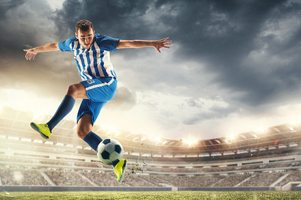 Male football or soccer player at stadium - motion, action, activity concept, a Sports & Recreation Photo by Volodymyr Melnyk