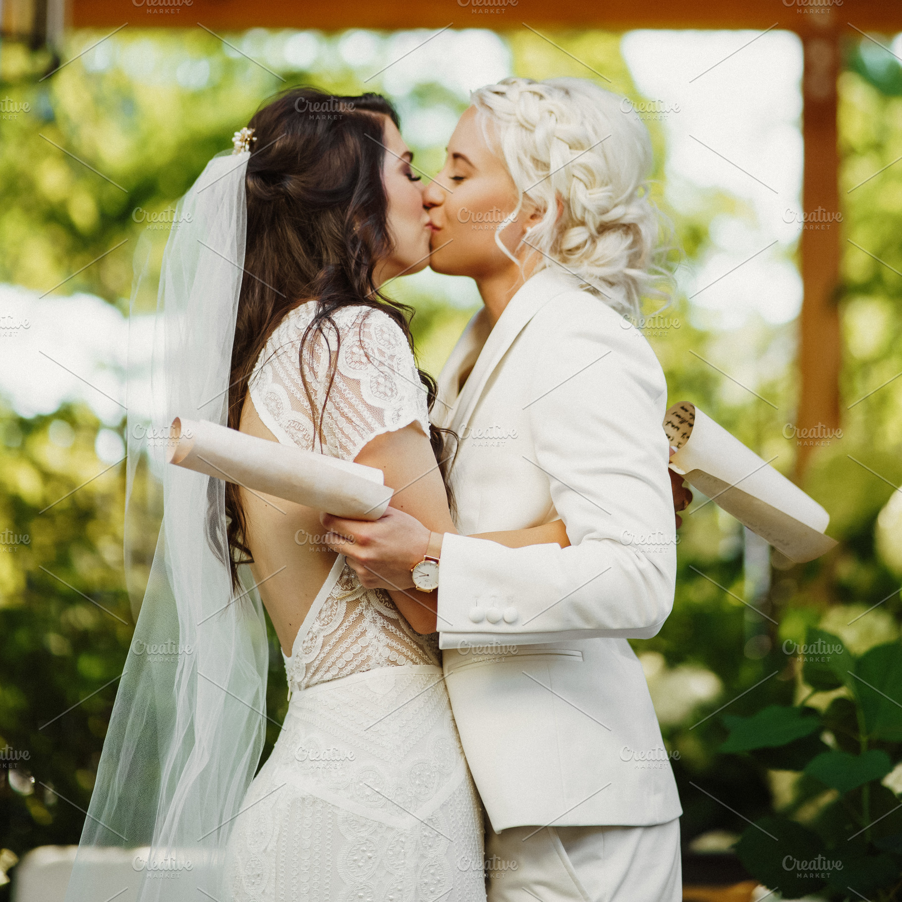 Lesbian wedding couple kissing, a Photo by IvashStudio
