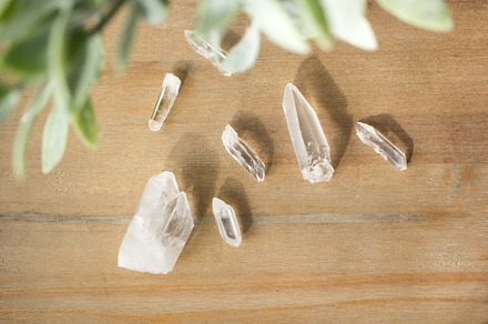 Quartz and greenery on wood table containing abundance, bohemian, and boho, a Beauty & Fashion Photo by olsenimagery