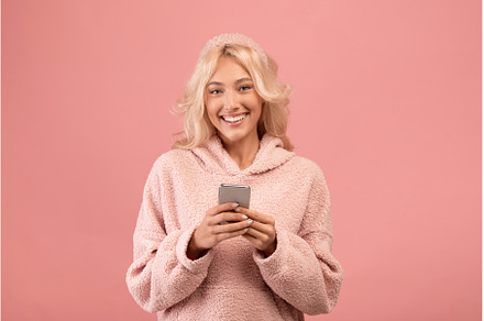 Portrait of happy lady using, a Person Photo by Prostock-Studio
