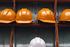 Hard Hats on Rack at Construction, an Industrial Photo by Stock Shape