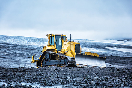 Yellow bulldozer in iceland containing iceland, desert, and nobody
