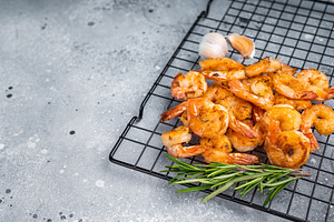 lavorful grilled prawns shrimps sizzling on the grill, inviting, a Food & Drink Photo by composter-box@mail.ru