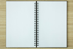 Open spiral notebook stock photo containing notebook and paper