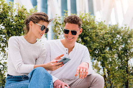 Modern business young business people in sunglasses using smartphone, a Person Photo by andreonegin market
