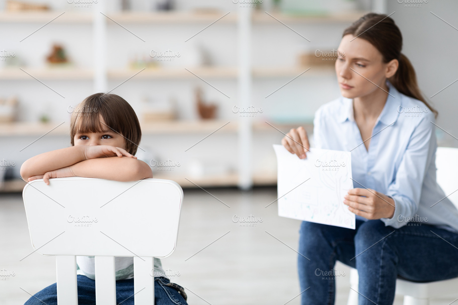 Inner mental problems. Stressed little boy sitting on chair and feeling upset,, a Photo by Prostock-Studio
