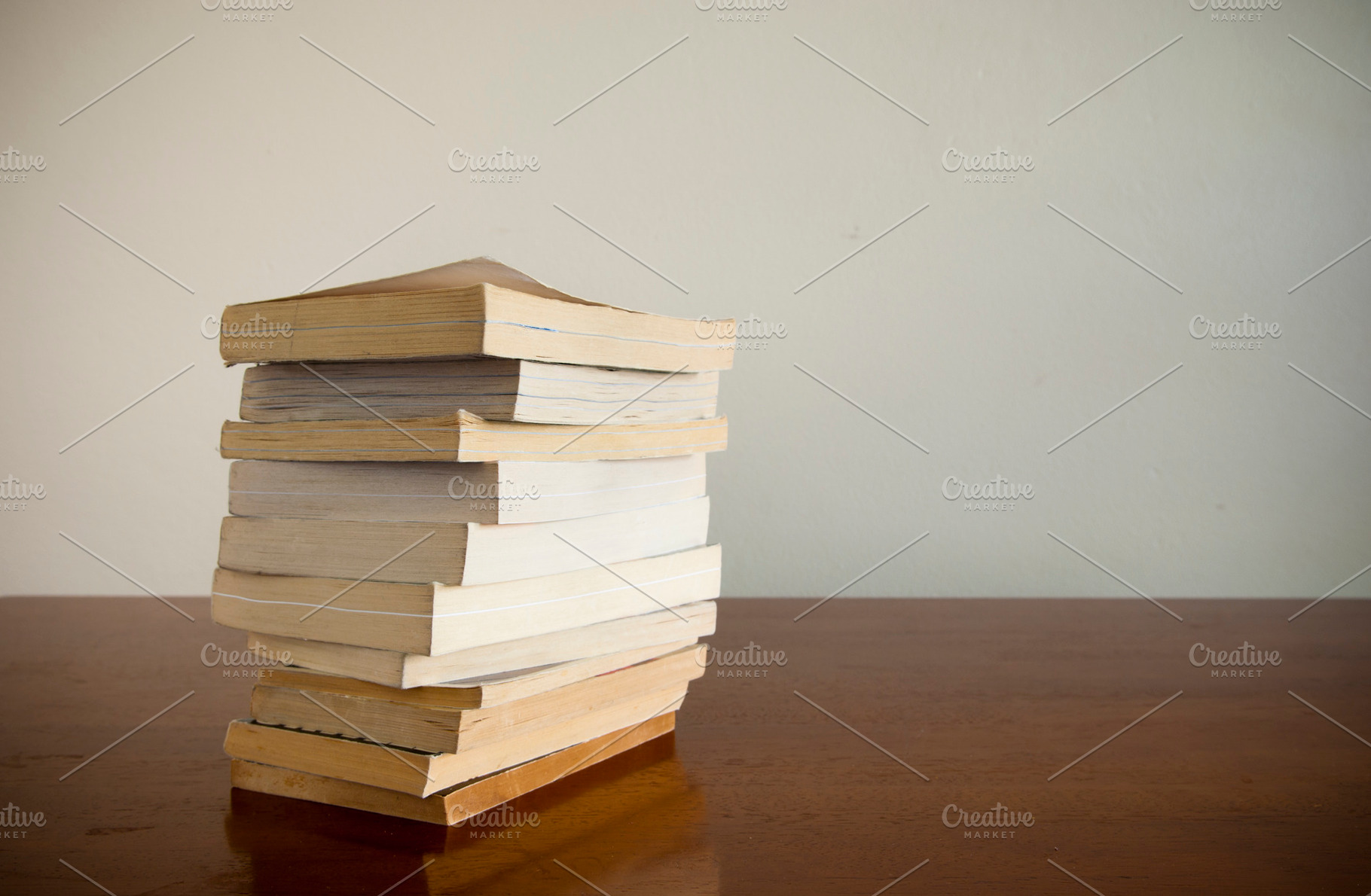 Book Stack on Table, a School & Education Photo by THP Creative