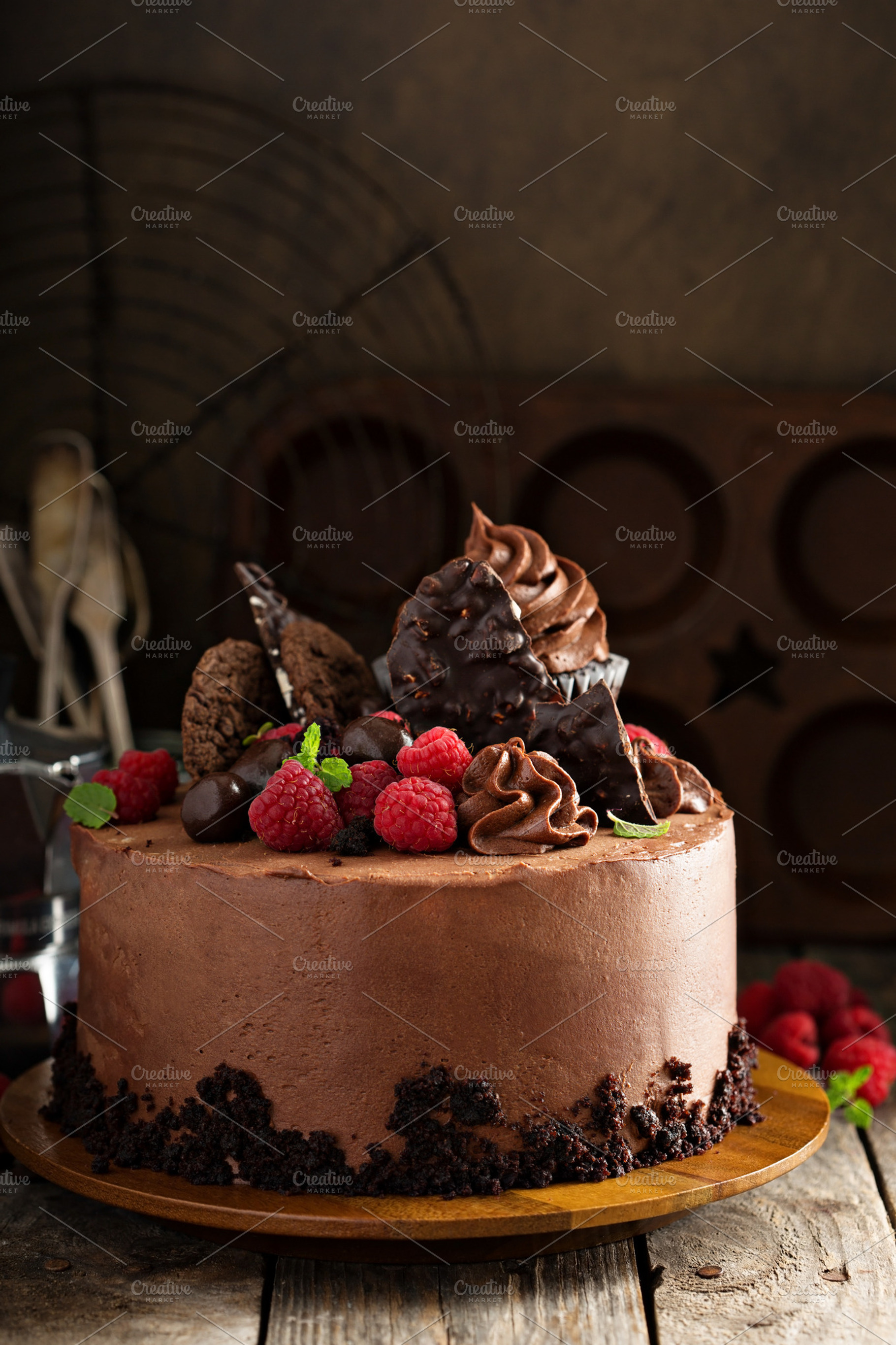 Chocolate cake with ganache frosting and raspberry featuring chocolate, cake, a Food & Drink Photo by farwasser