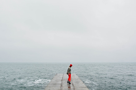 Girl on the concrete at winter sea featuring winter, alone, and beach