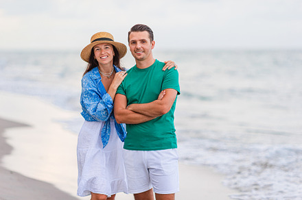 Young couple on white beach during summer vacation.