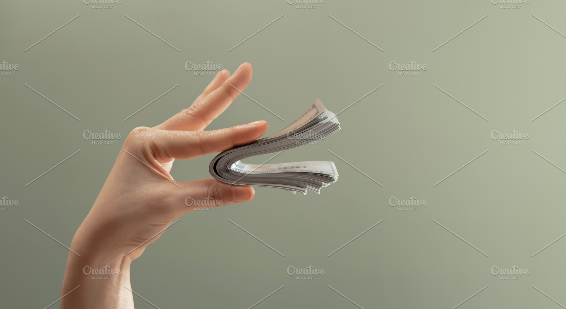 Hand holding bundle banknotes shaped like speaking mouth. Money, a Photo by salmon.black